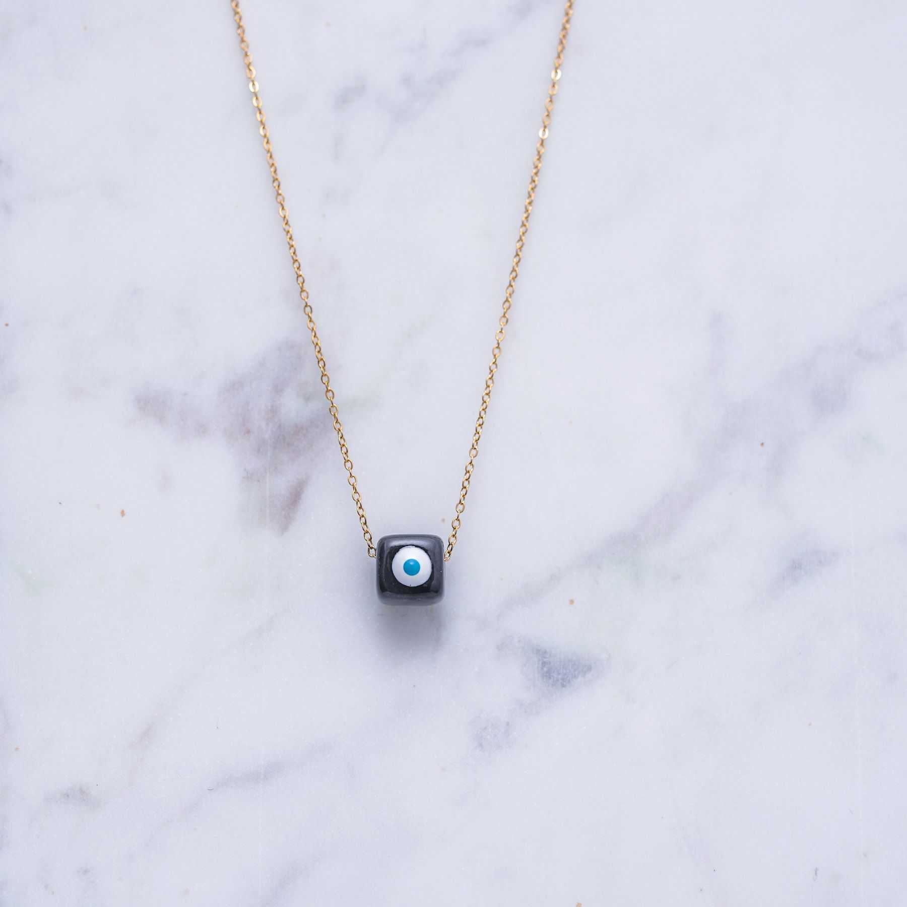 KIVOS CHARM NECKLACE - GOLD & BLACK