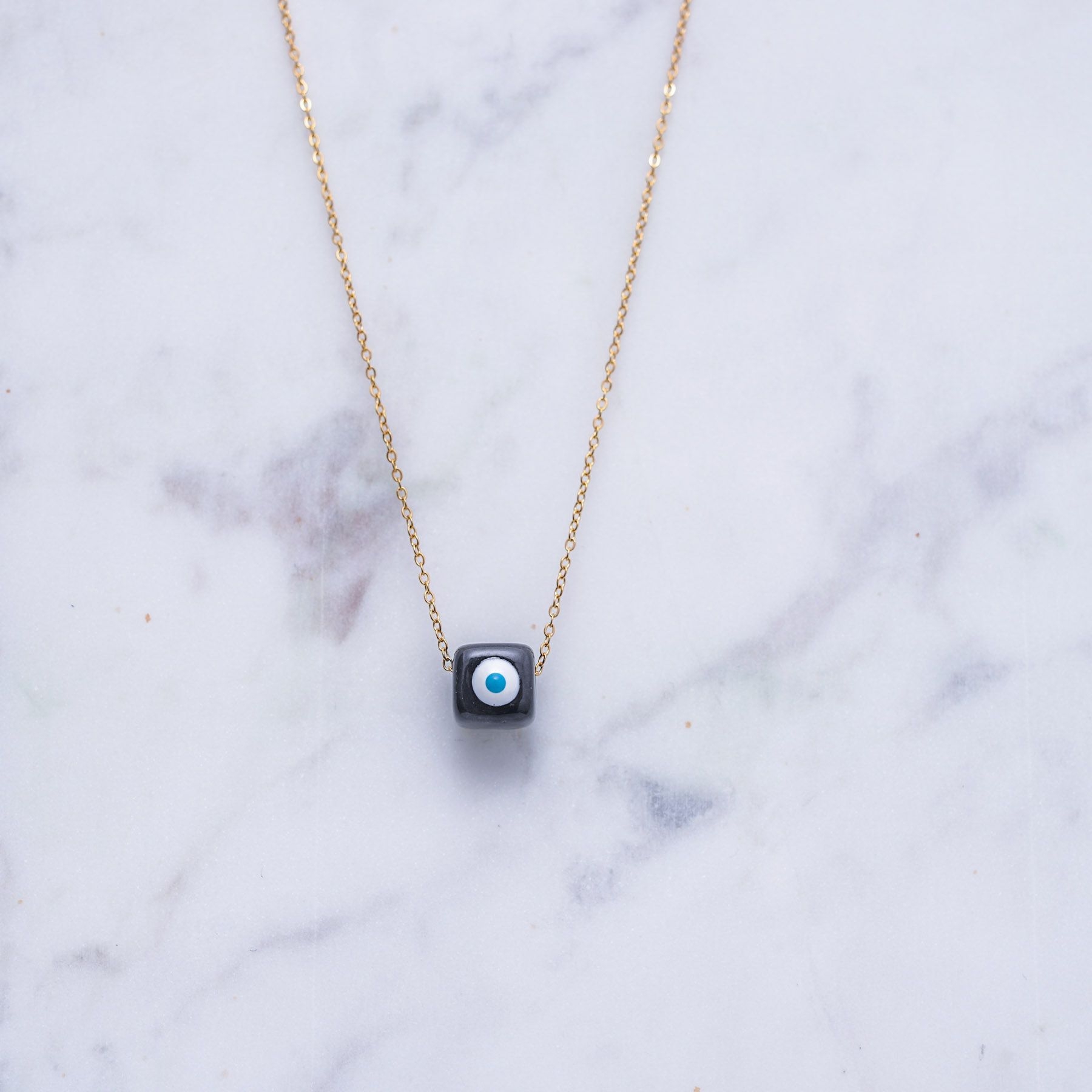 KIVOS CHARM NECKLACE - GOLD & BLACK ' - ' ΚΥΒΟΙ